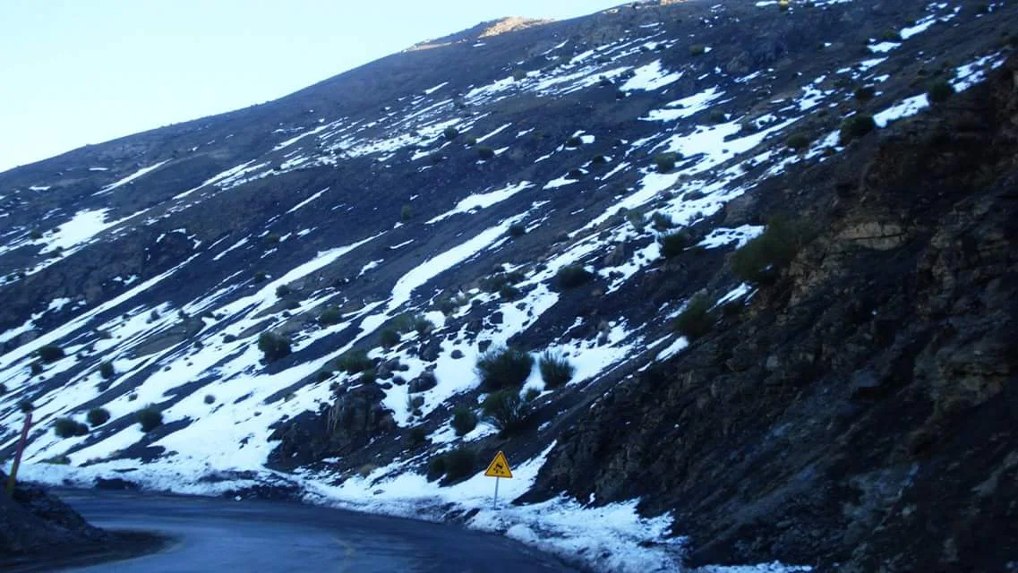 Snowy Tizi nTichka road in the Atlas Mountains; seasonal illustration, not current conditions